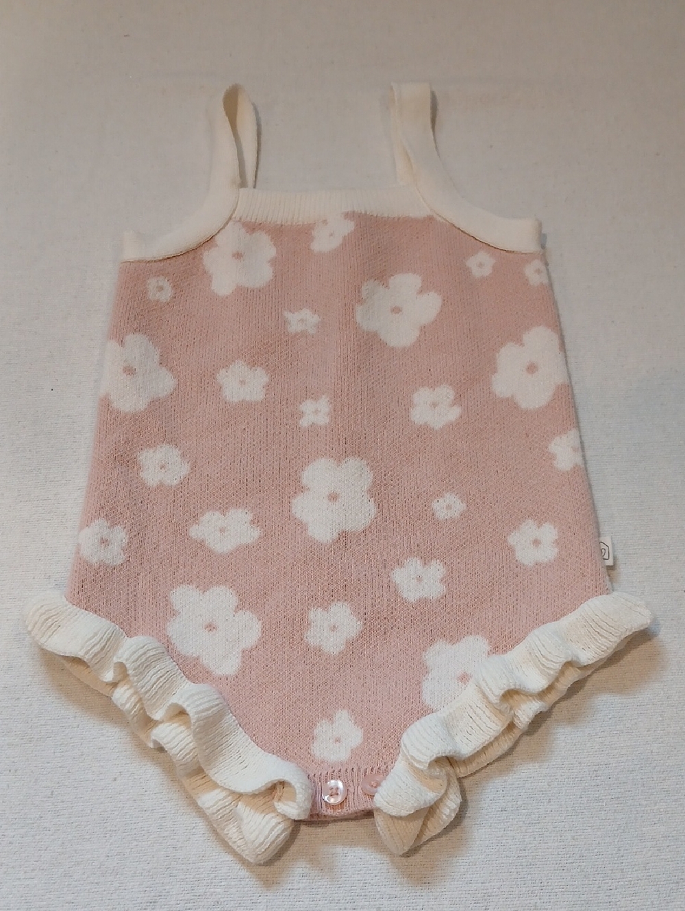 Smug Knit Pink Baby Romper with Cream Trim